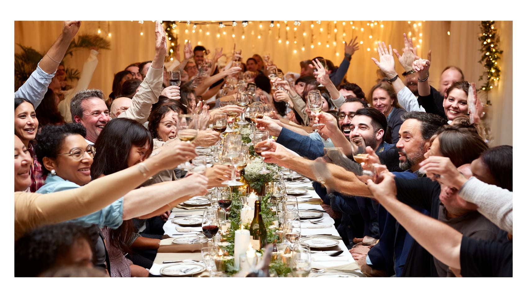 The JULY team celebrating together at a table during an evening awards dinner